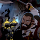 A warrior cuts through zombies with an axe.